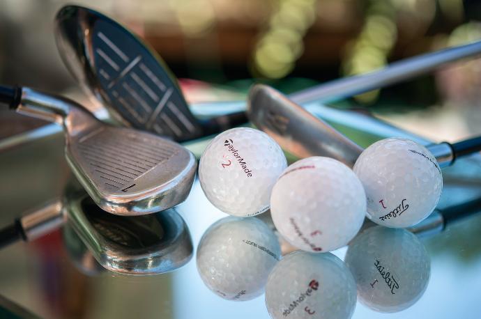 golf ball on green plastic container